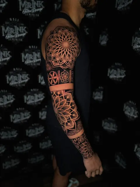 Mandala and dotwork sleeve tattoo in fine geometric detail, done at Mr Ink Bali, Seminyak