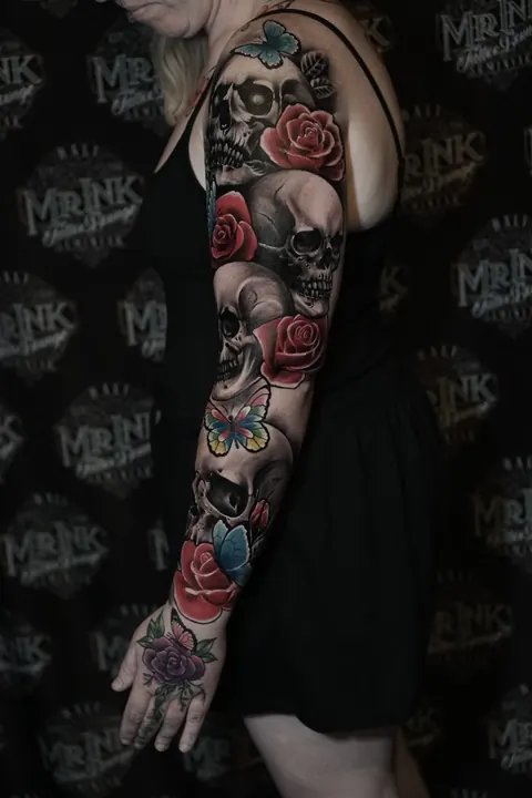 Colour skull and roses sleeve tattoo at Mr Ink Bali, a Seminyak tattoo studio