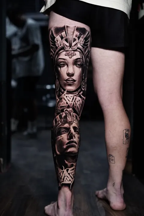 Egyptian queen and pharaoh leg sleeve tattoo in black and grey realism at Mr Ink Bali, Seminyak