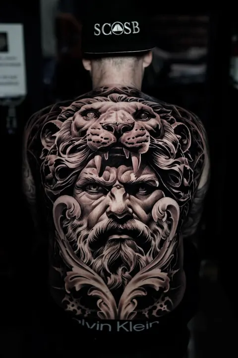 Hercules and lion black and grey realism back piece, tattooed at Mr Ink Bali tattoo studio in Seminyak